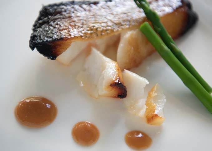 Showing flaky meat of grilled Gacier 51 Toothfish cooked using Nobu's Miso marinated Black Cod recipe.
