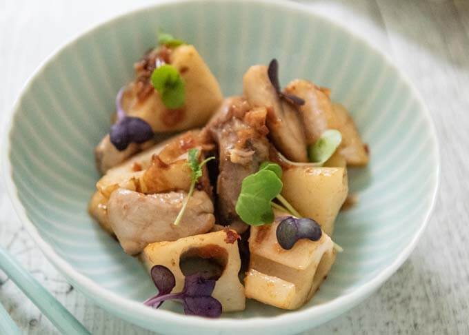 Sautéed Lotus Roots and Chicken with Pickled Plum and Bonito Flakes topped with microgreens.