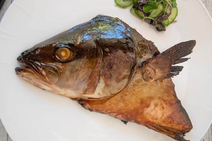 Top-down photo of Baked Kingfish Head with Soy Glaze (Kingfish Tsukeyaki).