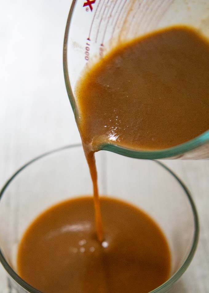 Hero shot of Demi-Glace - pouring the sauce into a bowl.