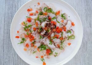 Top-down photo of Octopus Carpaccio.
