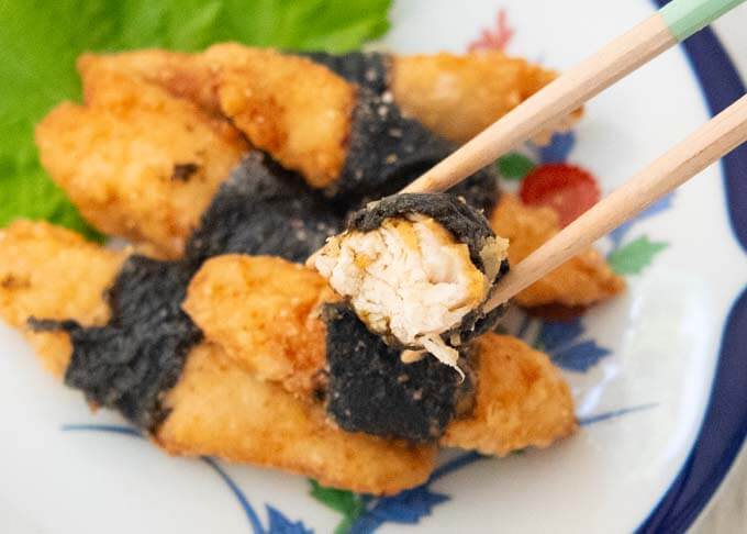 Showing a half-bitten piece of Fried Chicken Tenders Wrapped in Nori (Chicken Isobe-age).