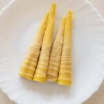 Boiled bamboo shoots on a plate, ready to use.