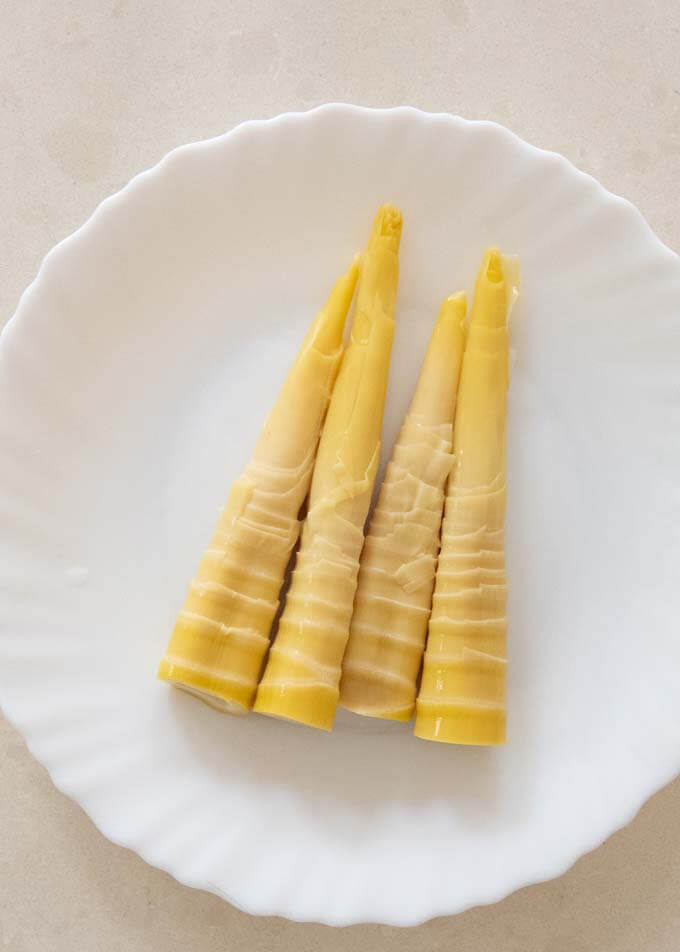 Boiled bamboo shoots on a plate, ready to use.