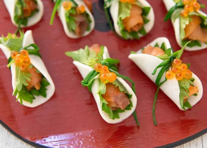 Luxurious version of Smoked Salmon Appetiser Bites with salmon roes on them.