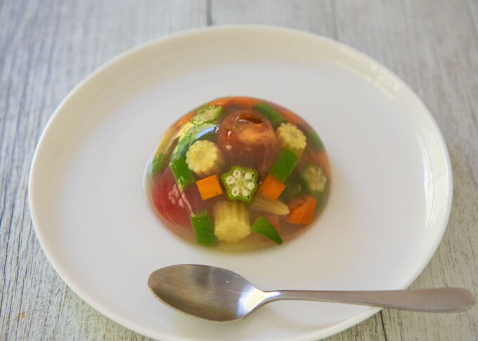 Dorm-shaped Summer Vegetable Salad in Jelly on a plate.