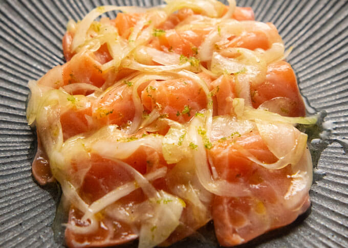 Zoomed-in photo of Marinated Salmon Sashimi in Yuzu.