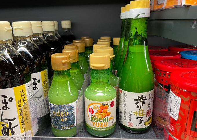 Different brands of yuzu juice in a bottle.