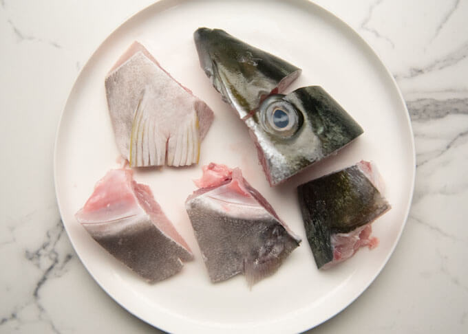 A half side of kingfish head cut into small pieces.