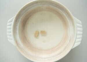Diluting condensed cubed powder in water.