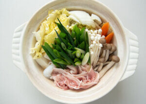 Add vegetables and meat to the pot with the broth.