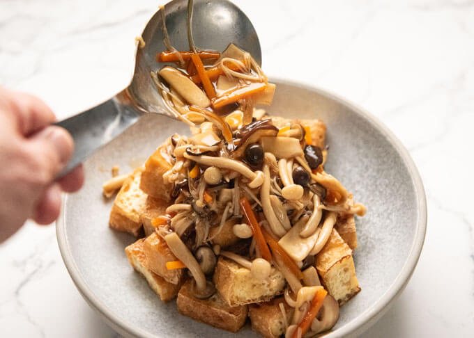 Pouring Thick Mushroom Sauce (Mushroom Ankake) over Fried Tofu.