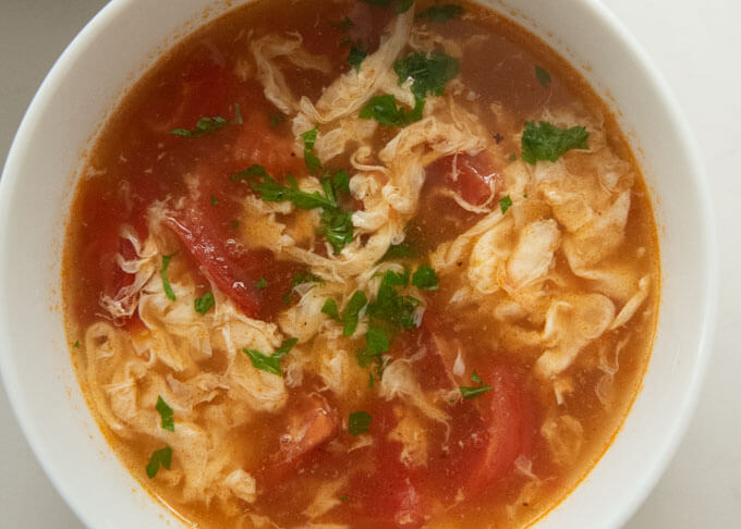 Top-down photo of Tomato and Egg Drop Soup.