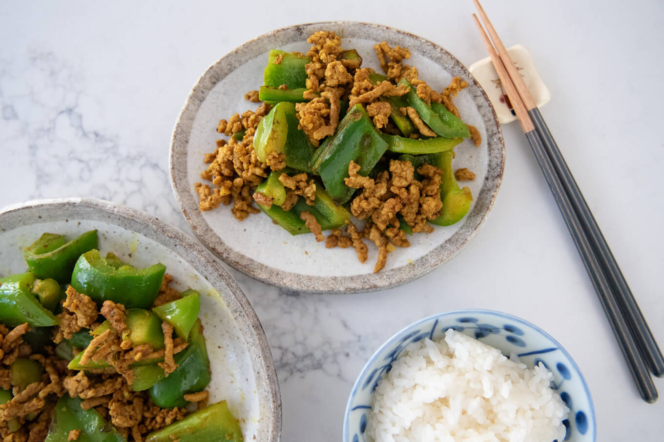 Curry Pork Stir-Fry with Capsicum with a bowl of rice.