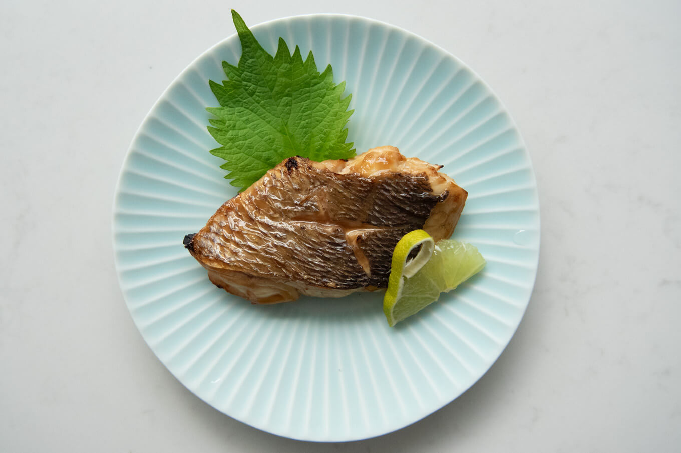 Snapper Yūan Yaki on a plate.