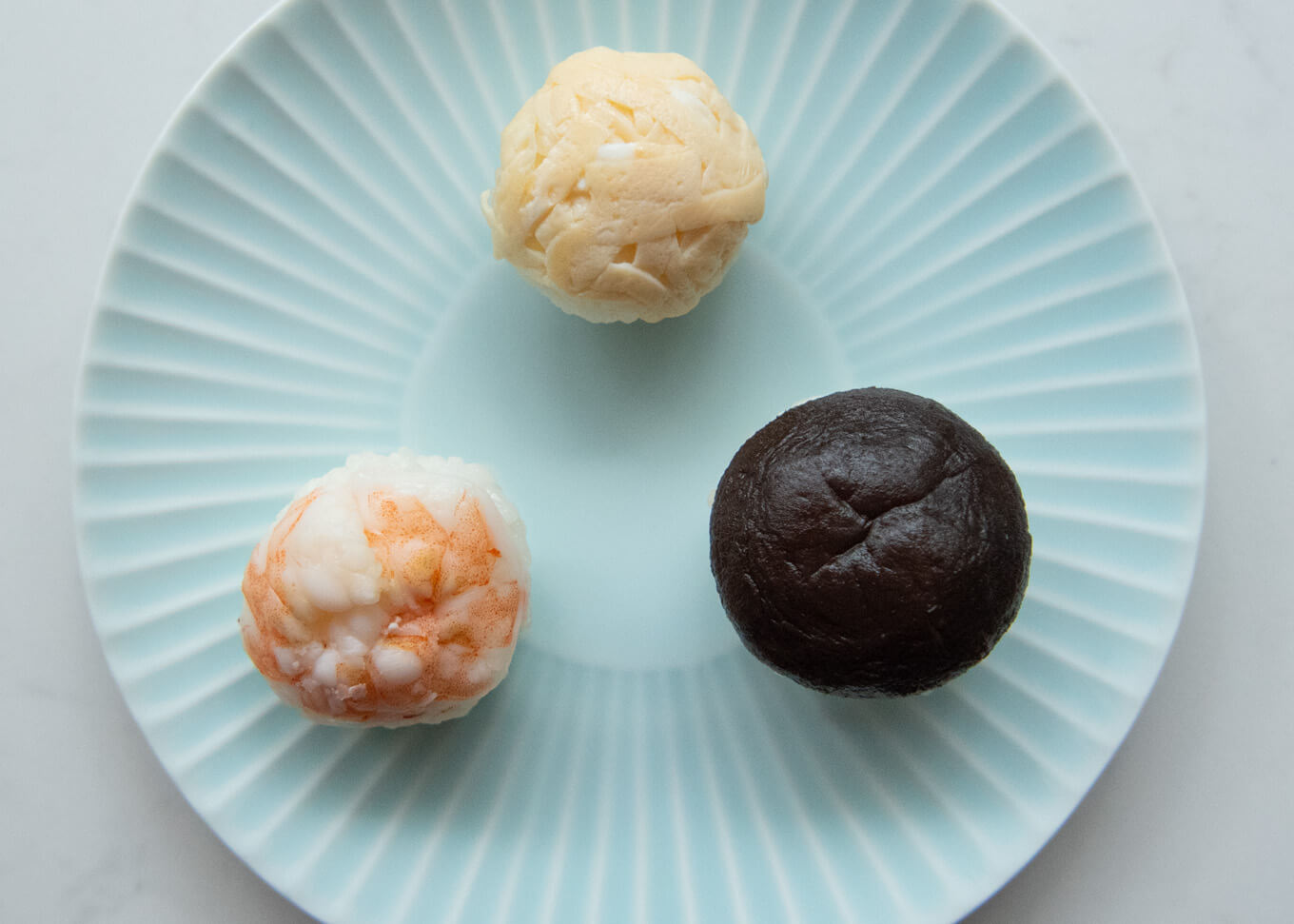 Temari Sushi with kinshi tamago, simmered shiitake mushroom, and a cooked prawn.