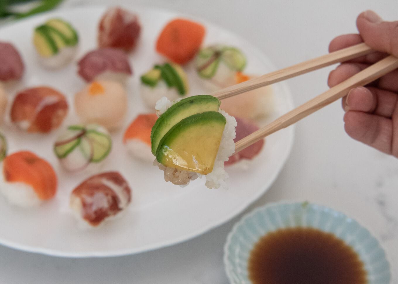 Showing how to eat Temari Sushi.