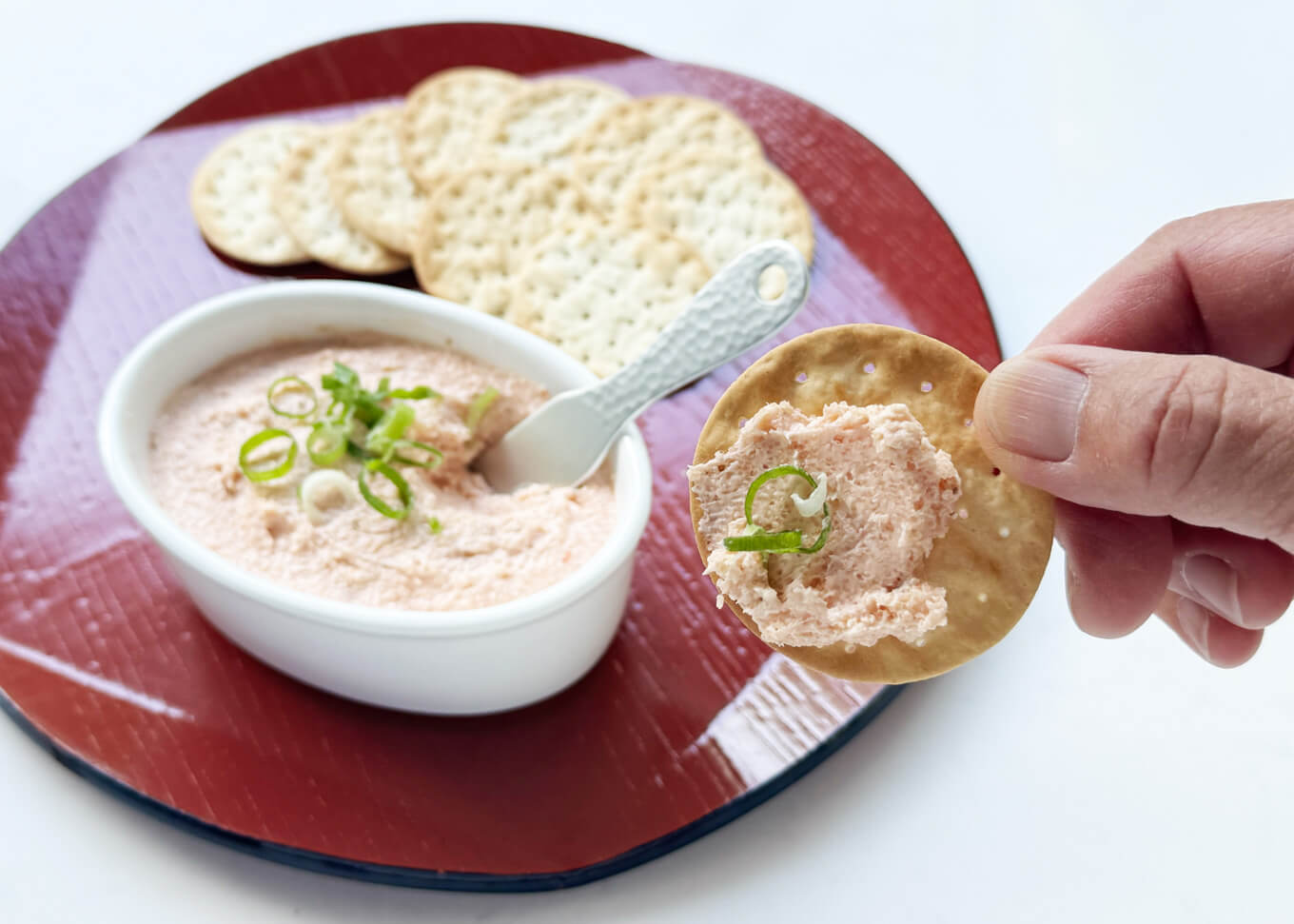 Cream Cheese Dip with Spicy Pollock Roe scooped with a cracker.