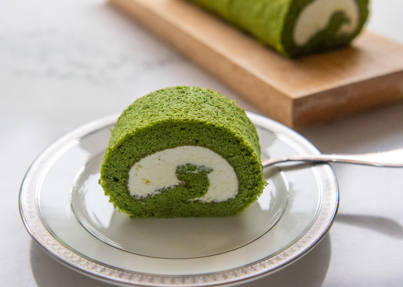 Matcha Roll Cake served on a plate.