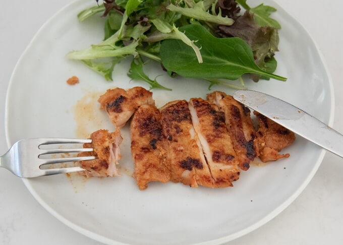 Half-eaten Spicy Miso Marinated Chicken on the plate.